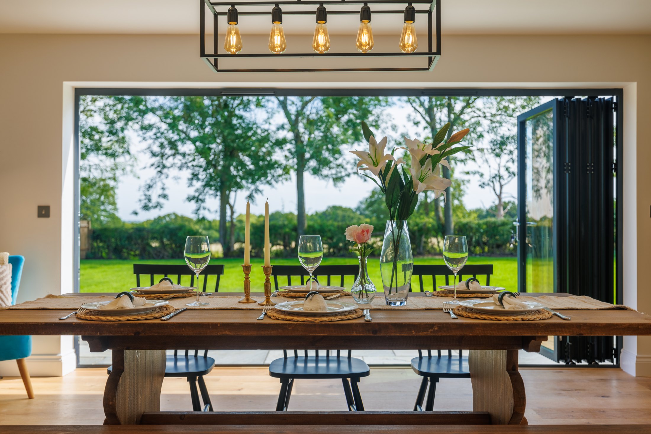 A carefully composed dining room opening onto the garden at Hookstile Farm