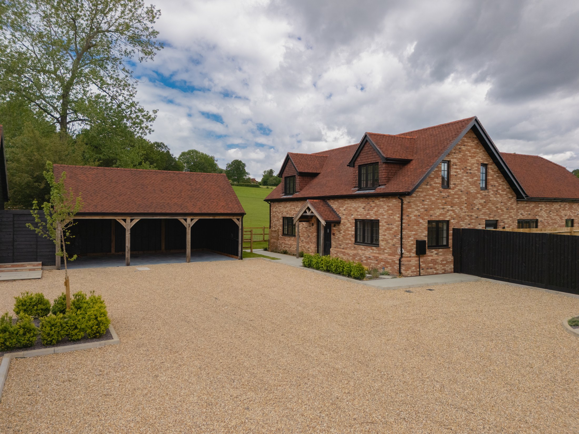 Brick house and oak-framed carport at Meadow View