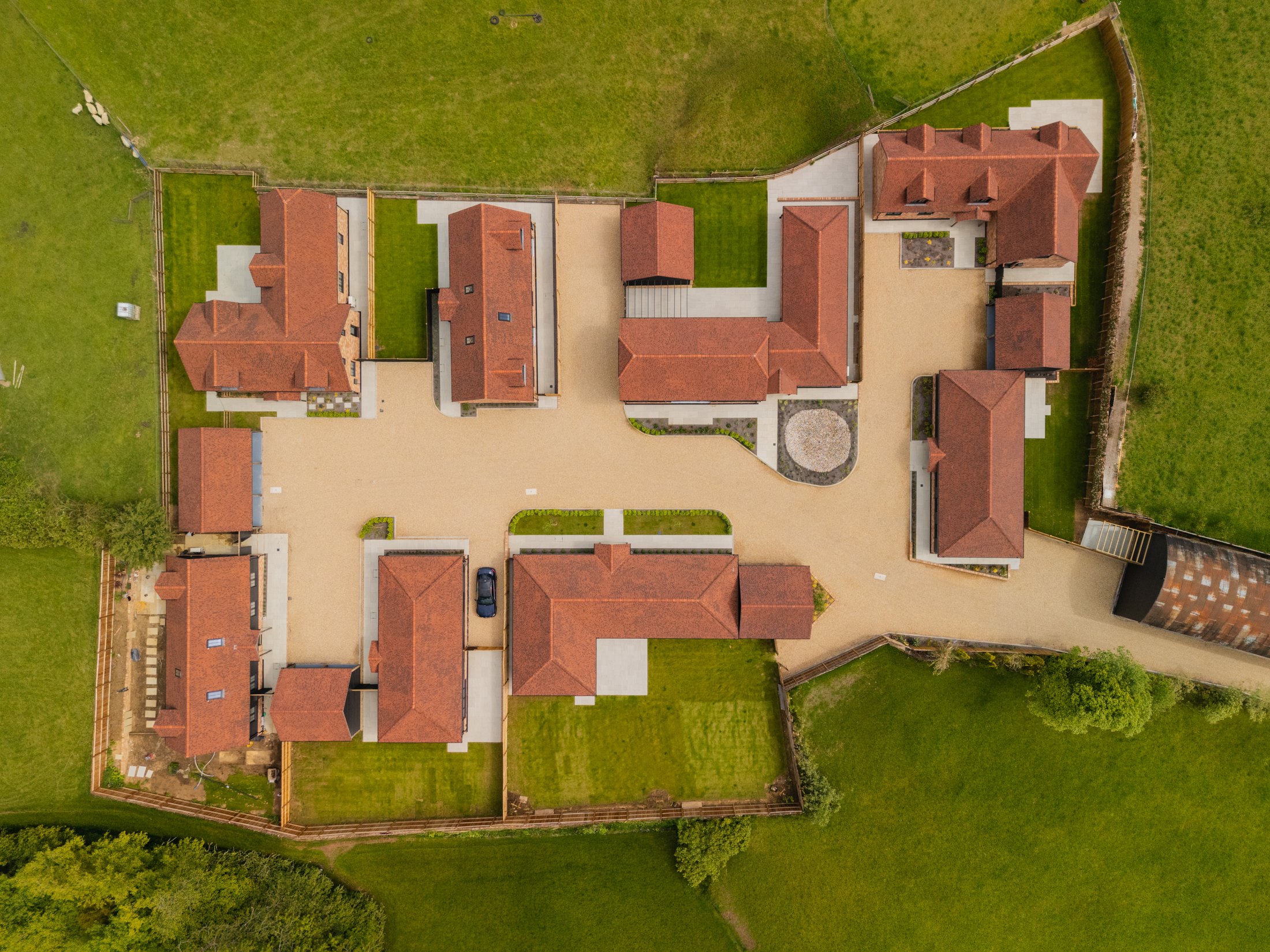 Meadow View from directly above, with tiled roofs and courtyards surrounded by fields
