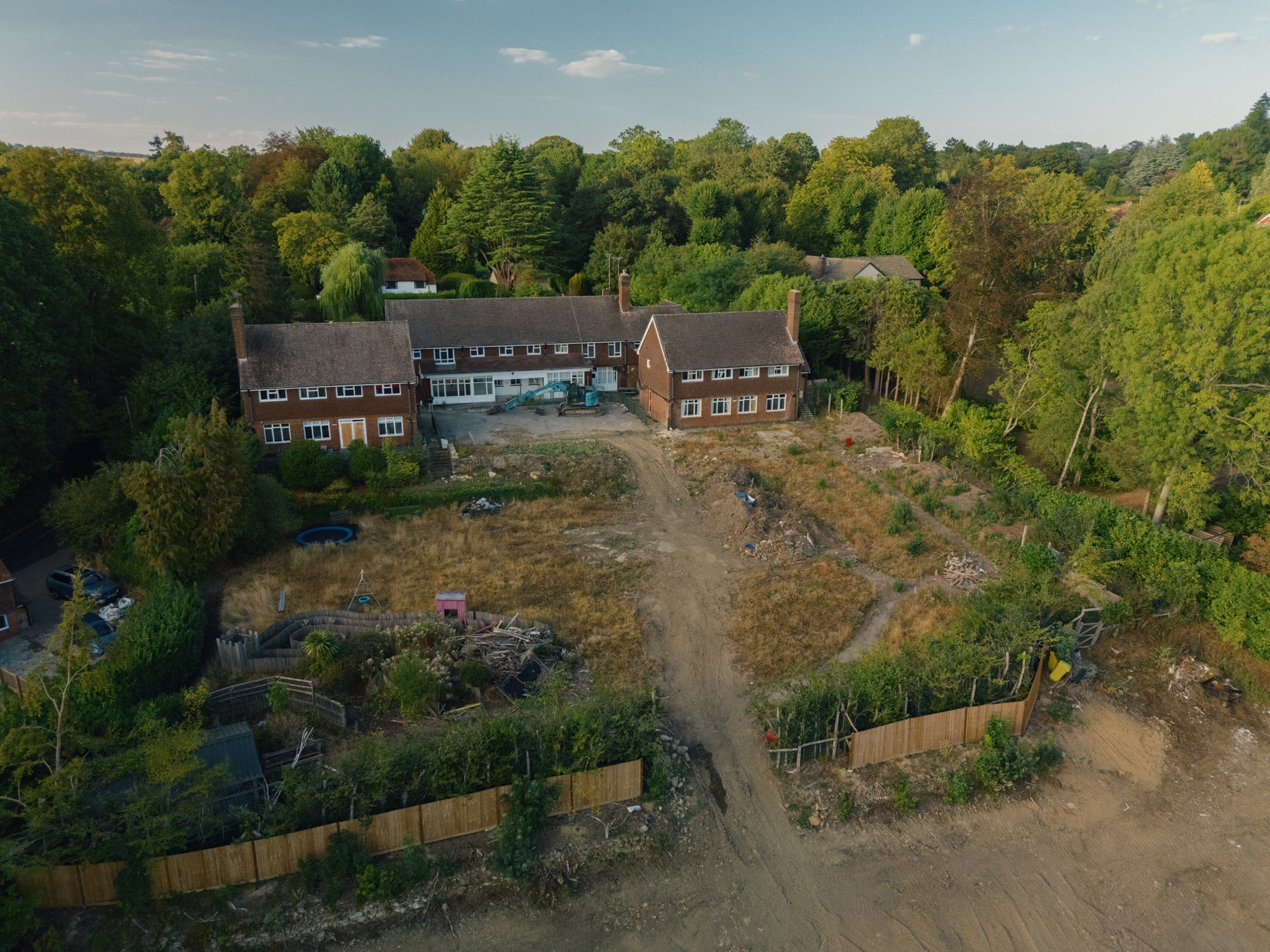 Original drone photograph of the existing buildings and cleared gardens at Pastens